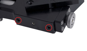 Remove the two indicated set screws with a 1.5 mm hex key before mounting the device on edge